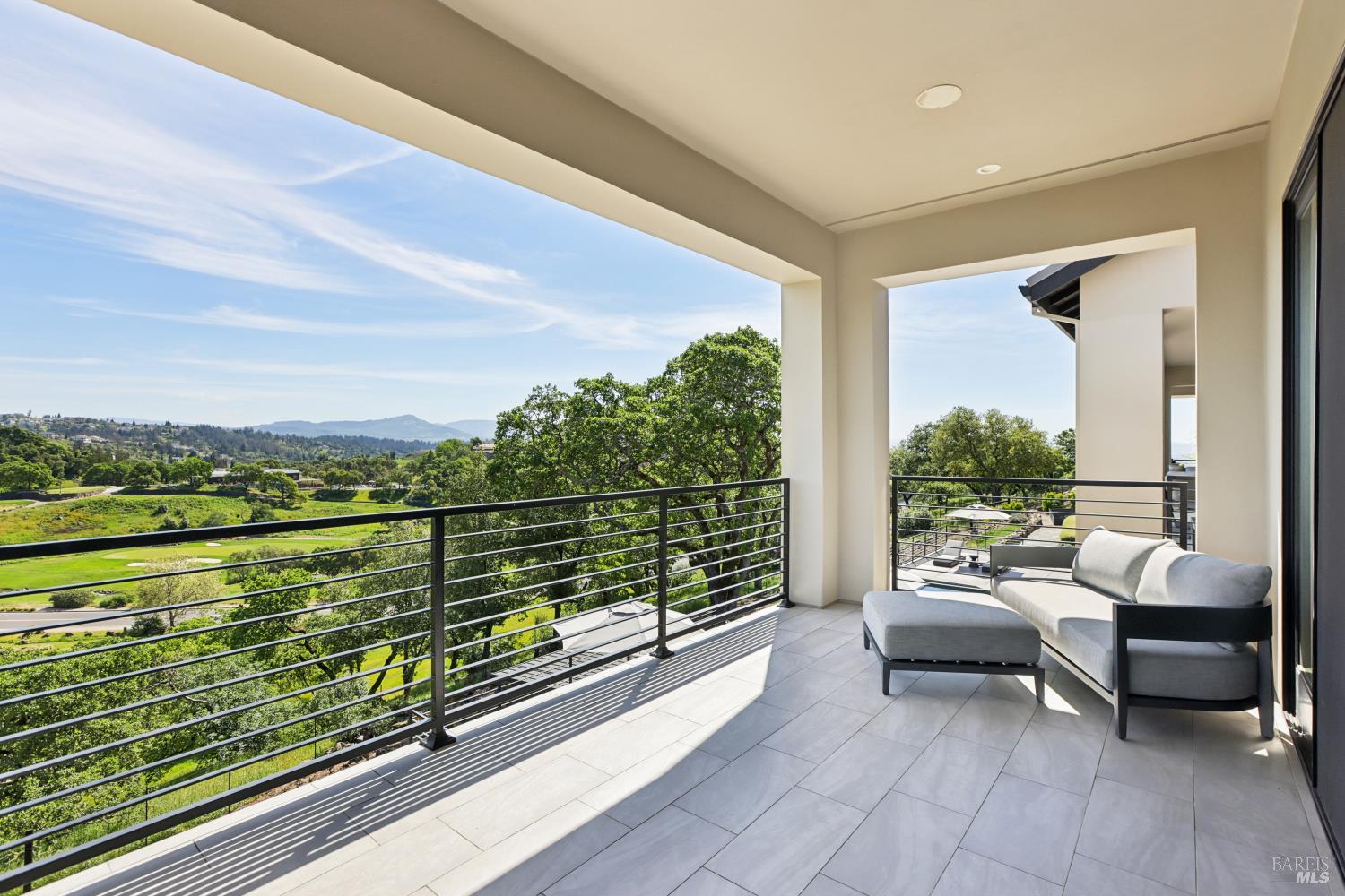 3758 Skyfarm Drive Santa Rosa, CA 95403 - Photo 34 of 80 a balcony with furniture and a lake view