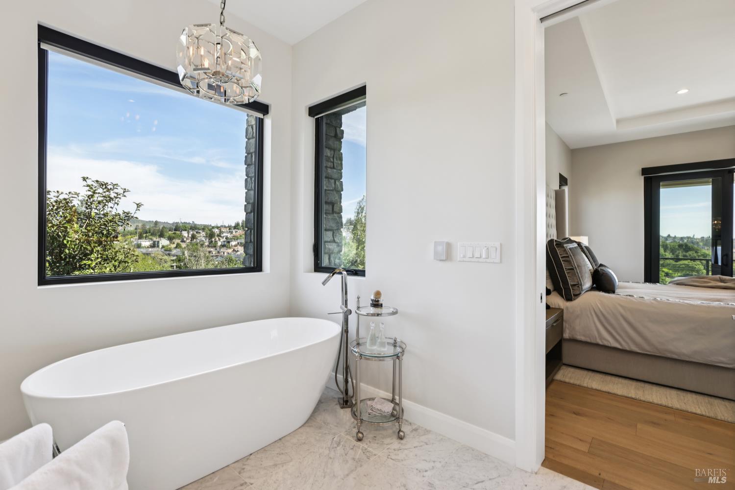 3758 Skyfarm Drive Santa Rosa, CA 95403 - Photo 36 of 80 a spacious bathroom with a large tub and chandelier