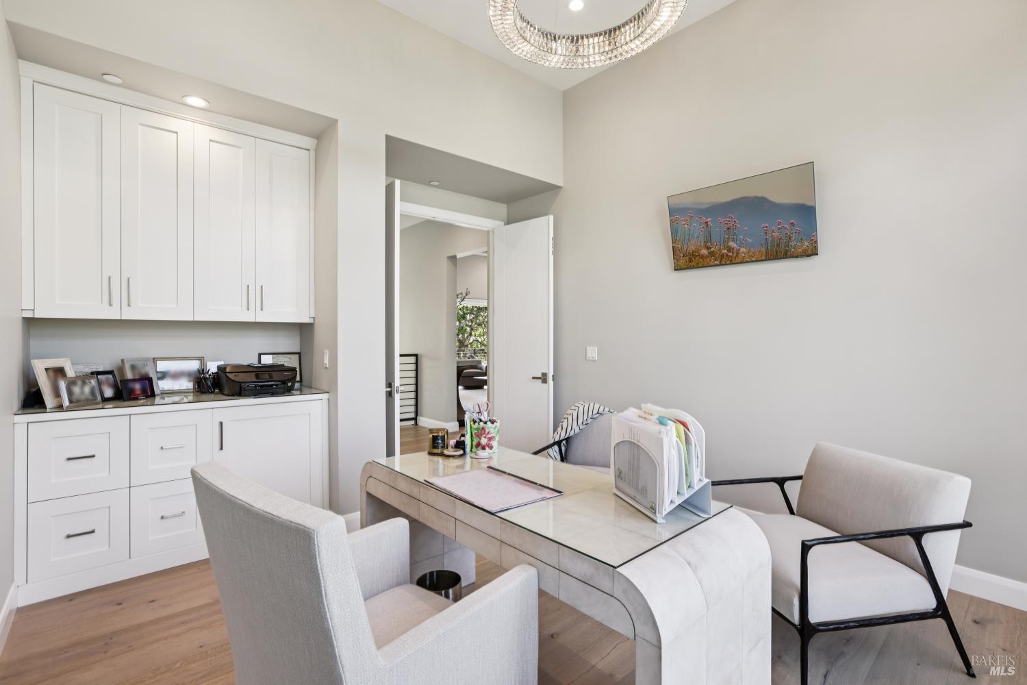 3758 Skyfarm Drive Santa Rosa, CA 95403 - Photo 42 of 80 a kitchen with a dining table chairs and white cabinets