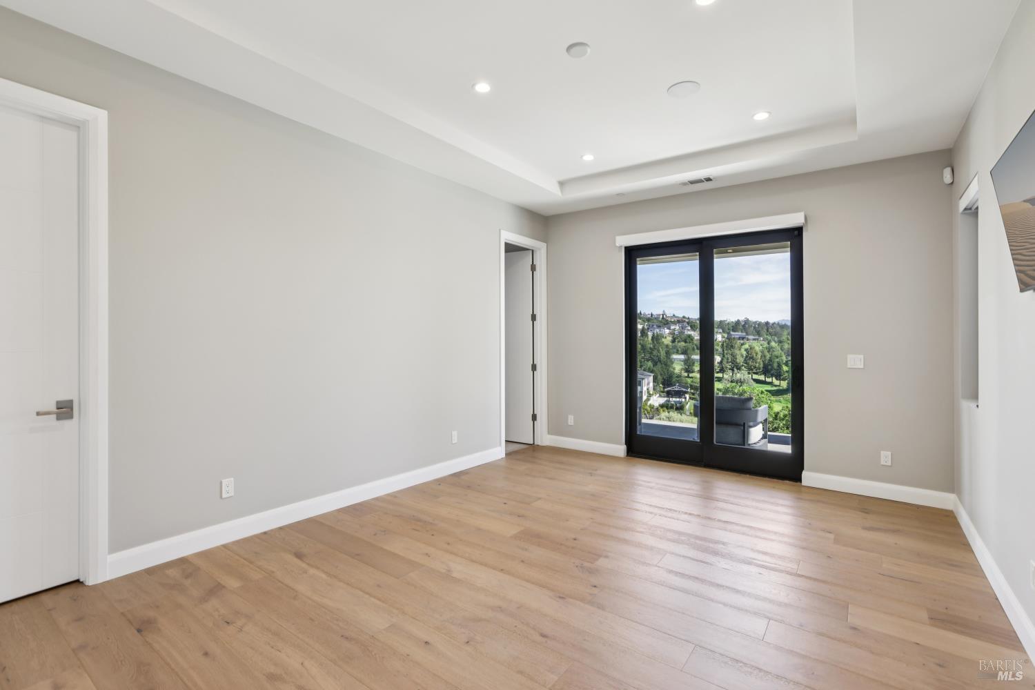 3758 Skyfarm Drive Santa Rosa, CA 95403 - Photo 55 of 80 a view of an empty room with wooden floor and a window
