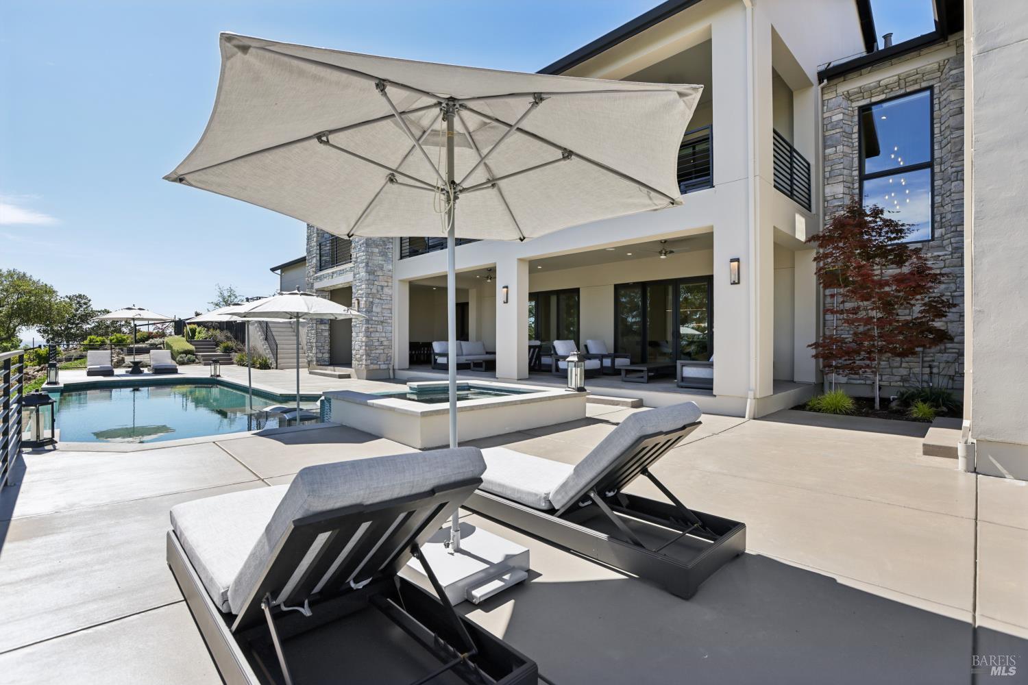 3758 Skyfarm Drive Santa Rosa, CA 95403 - Photo 59 of 80 a view of a patio with a table and chairs under an umbrella