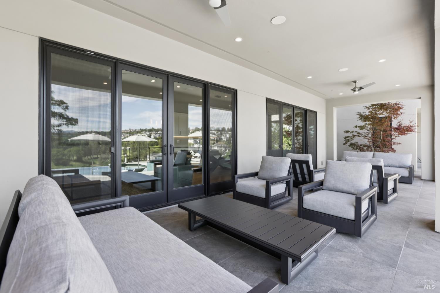 3758 Skyfarm Drive Santa Rosa, CA 95403 - Photo 65 of 80 a living room with furniture and a floor to ceiling window