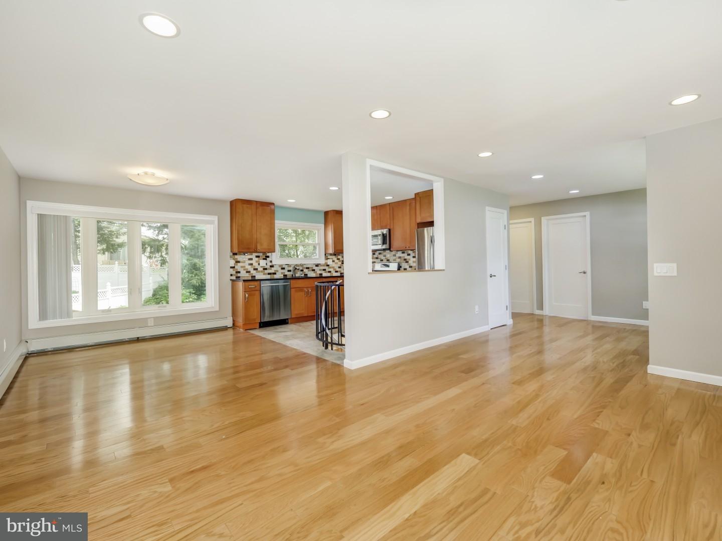 15 St Dunstans Road Hatboro, PA 19040 - Photo 2 of 25 a view of an empty room with a window and wooden floor