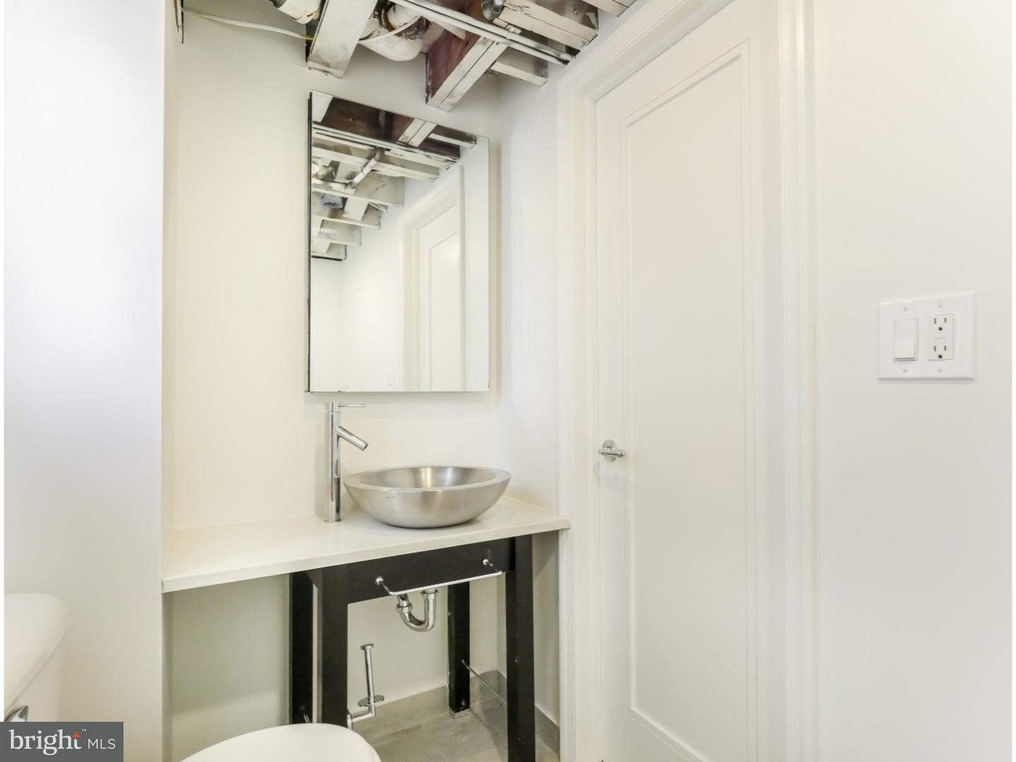 15 St Dunstans Road Hatboro, PA 19040 - Photo 16 of 25 a bathroom with a sink a mirror and a toilet