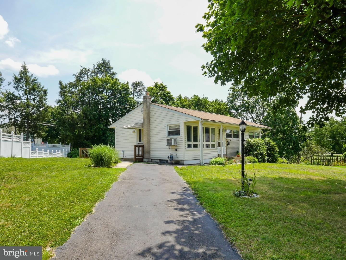15 St Dunstans Road Hatboro, PA 19040 - Photo 19 of 25 a front view of house with a garden and trees