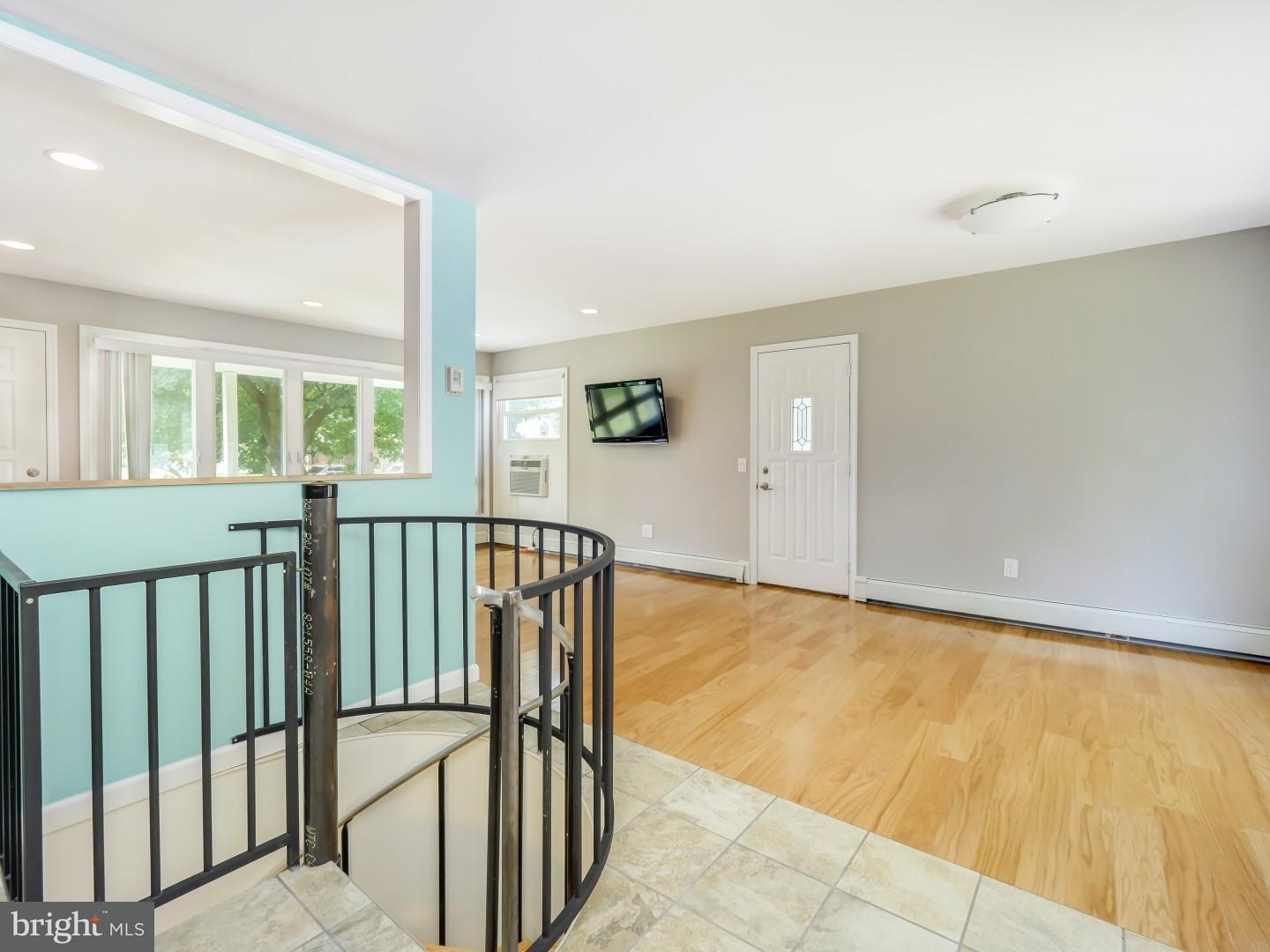 15 St Dunstans Road Hatboro, PA 19040 - Photo 10 of 25 a view of a hallway with wooden floor and staircase