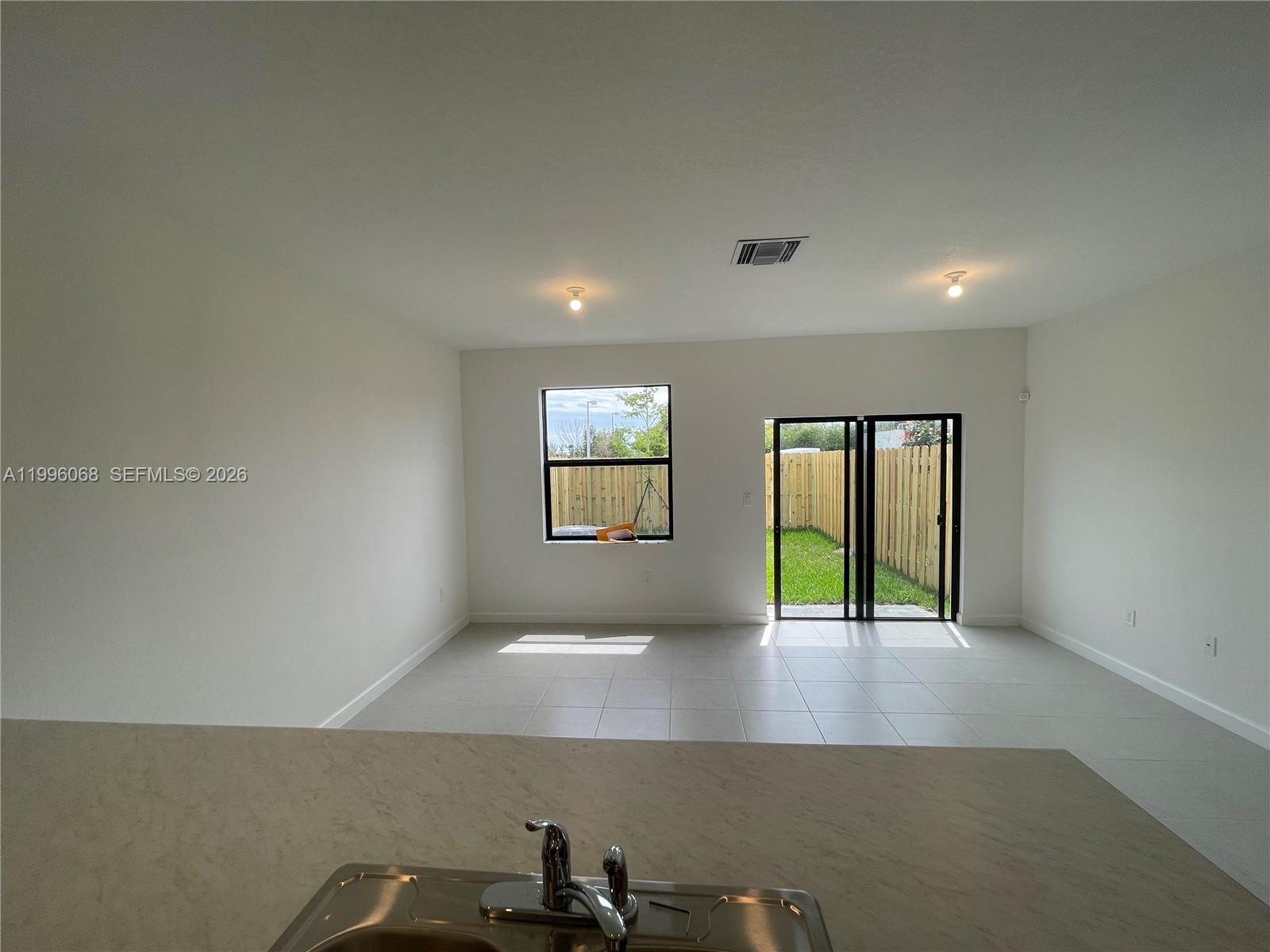 13262 Southwest 287th Terrace Homestead, FL 33033 - Photo 10 of 33 an empty room with windows