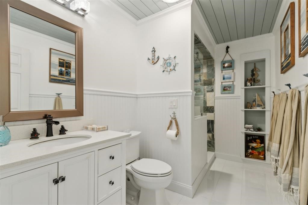 1656 Rigging Way Fernandina Beach, FL 32034 - Photo 37 of 70 Full guest bathroom, custom tile travertine