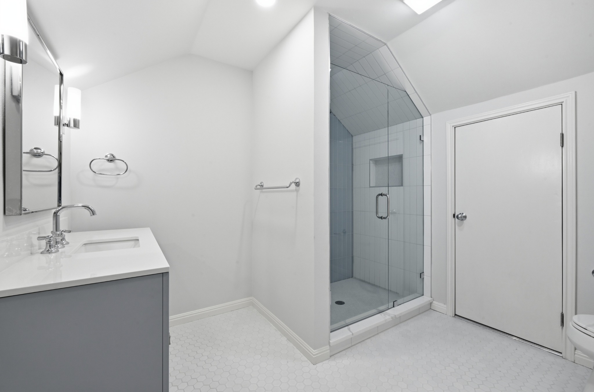 1107 Bowie Road Austin, TX 78733 - Photo 25 of 40 A refined bathroom featuring clean lines, modern fixtures, and a spacious glass-enclosed shower.