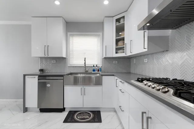 a kitchen with cabinets and appliances