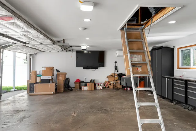 a view of a livingroom with furniture and a flat screen tv