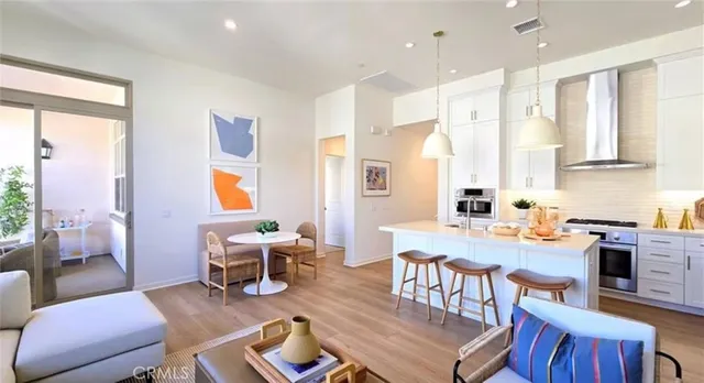 a workspace with furniture wooden floor and a window