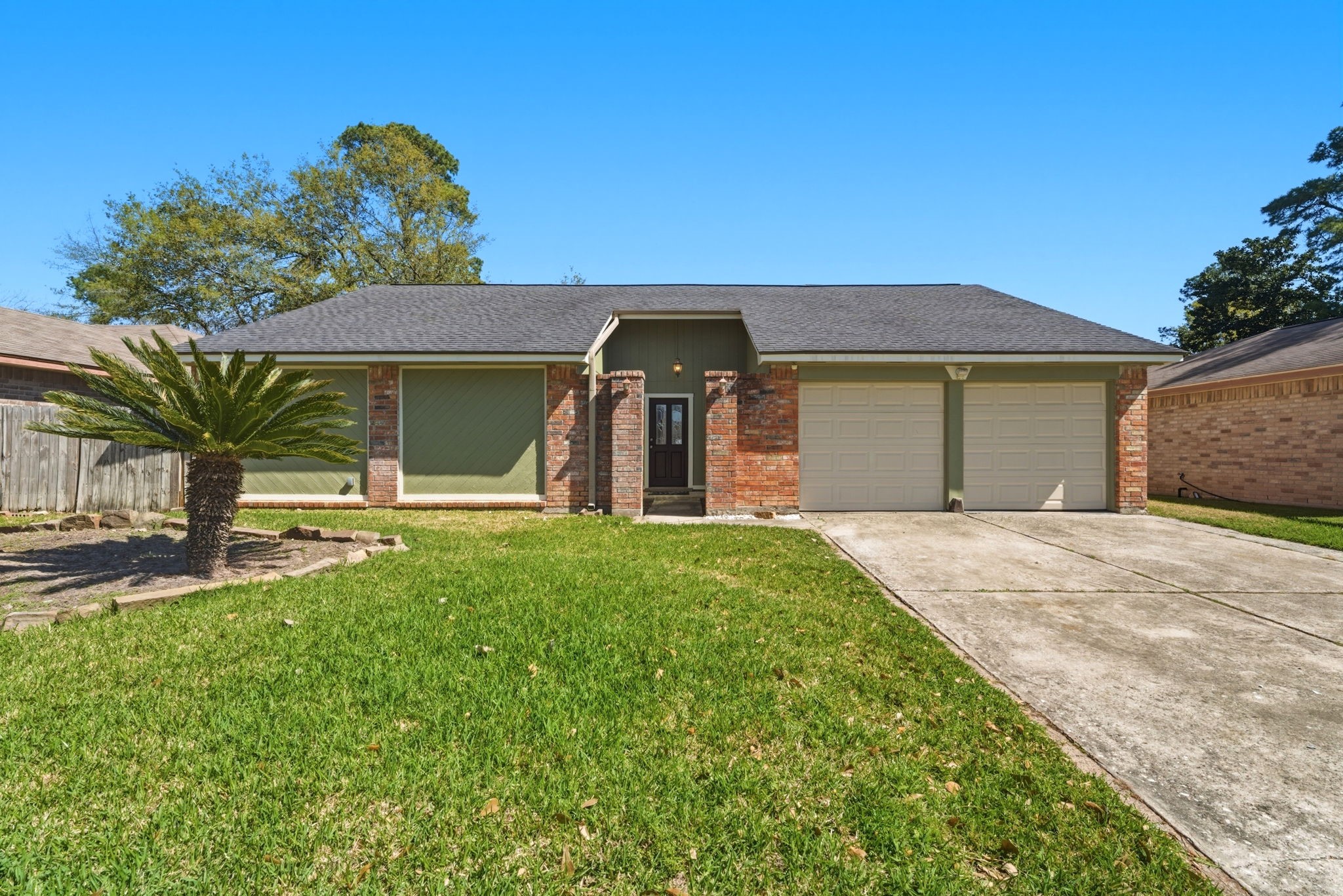21514 Slippery Creek Lane Spring, TX 77388 - Photo 2 of 27 a front view of a house with a garden and yard