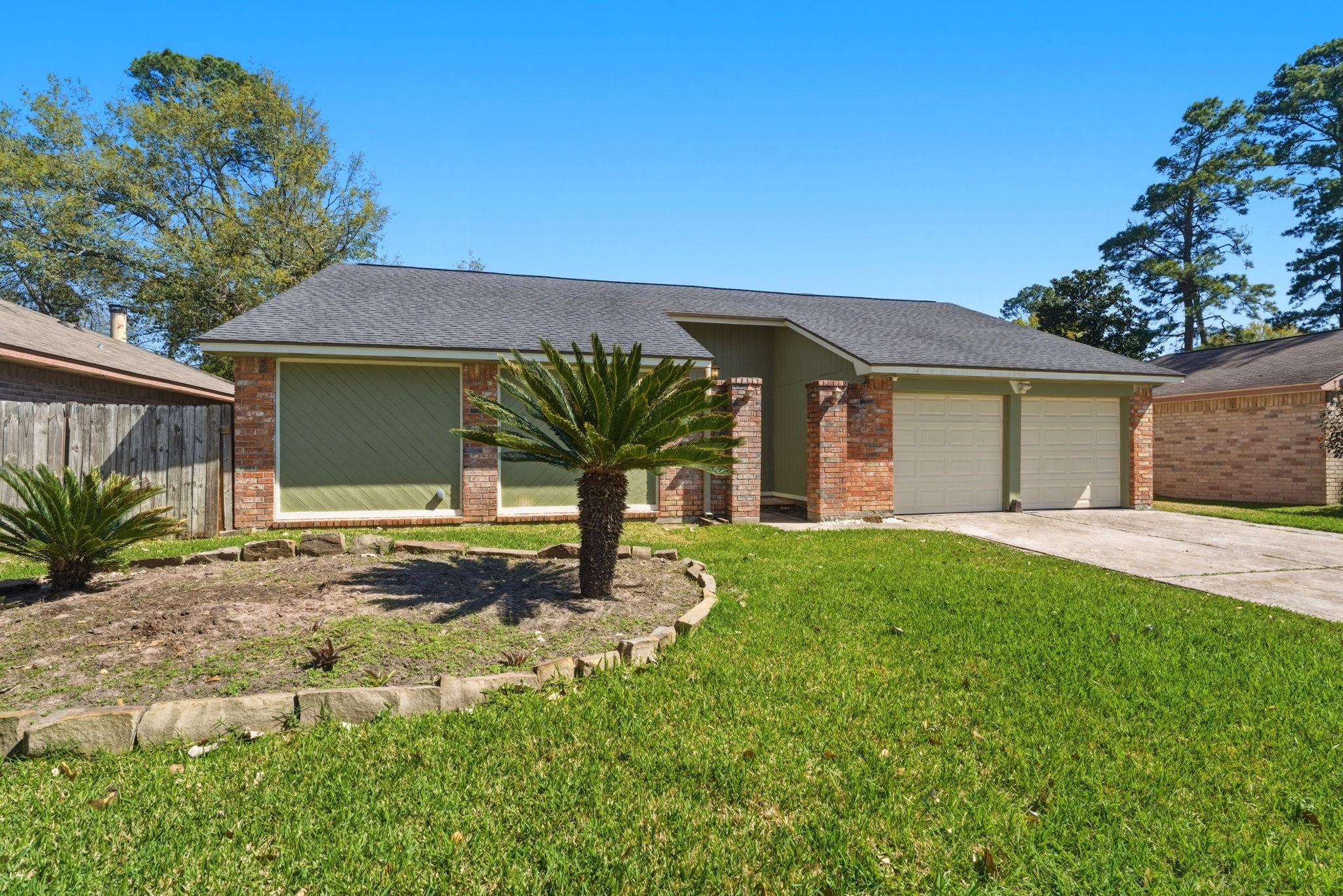 21514 Slippery Creek Lane Spring, TX 77388 - Photo 26 of 27 a house view with a garden space