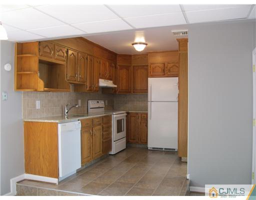 78 Brandywine Road Fords, NJ 08863 - Photo 2 of 13 a kitchen with stainless steel appliances granite countertop a refrigerator a stove and a sink
