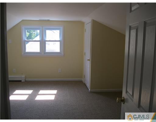 78 Brandywine Road Fords, NJ 08863 - Photo 6 of 13 a view of empty room with a window