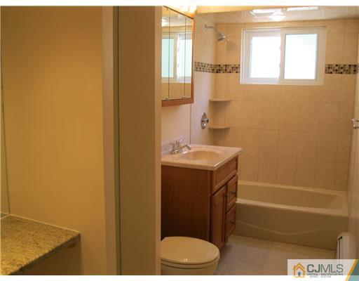 78 Brandywine Road Fords, NJ 08863 - Photo 7 of 13 a bathroom with a sink and a mirror