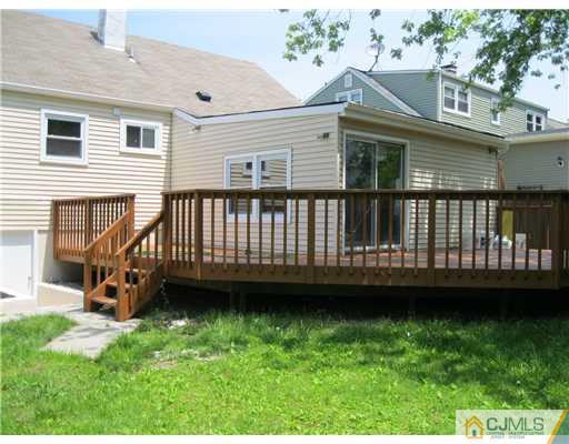 78 Brandywine Road Fords, NJ 08863 - Photo 8 of 13 a view of a house with a backyard and deck