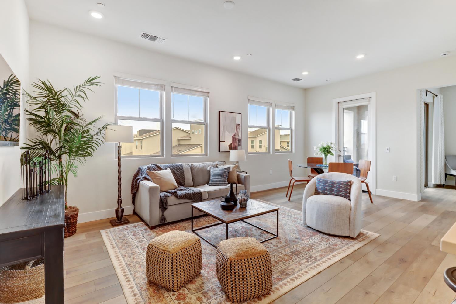 1661 Spring Street, Unit 343 Davis, CA 95616 - Photo 1 of 52 a living room with furniture and a potted plant