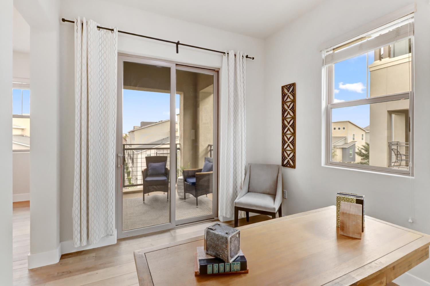 1661 Spring Street, Unit 343 Davis, CA 95616 - Photo 11 of 52 a living room with furniture and a window