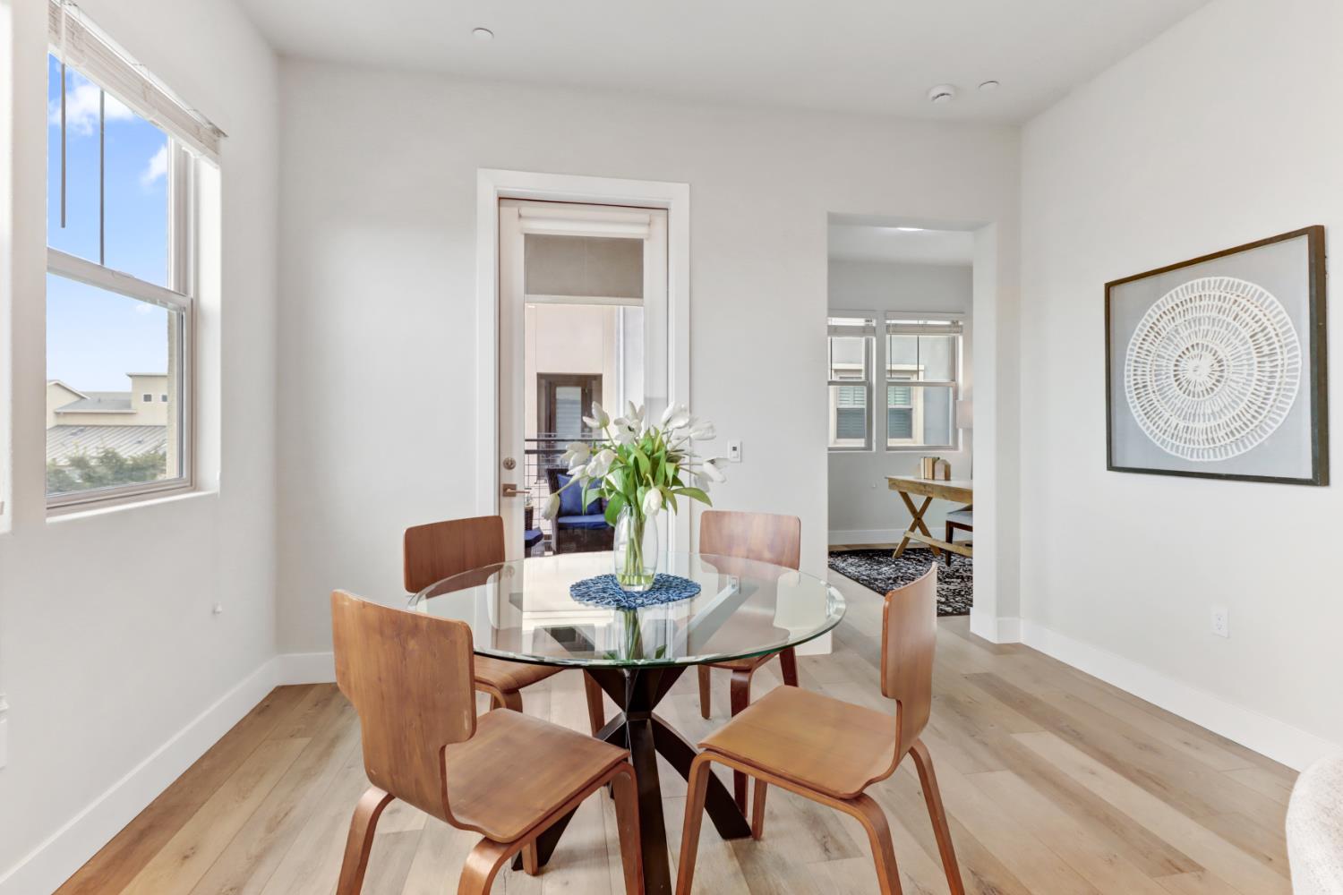 1661 Spring Street, Unit 343 Davis, CA 95616 - Photo 12 of 52 a view of a dining room with furniture and wooden floor