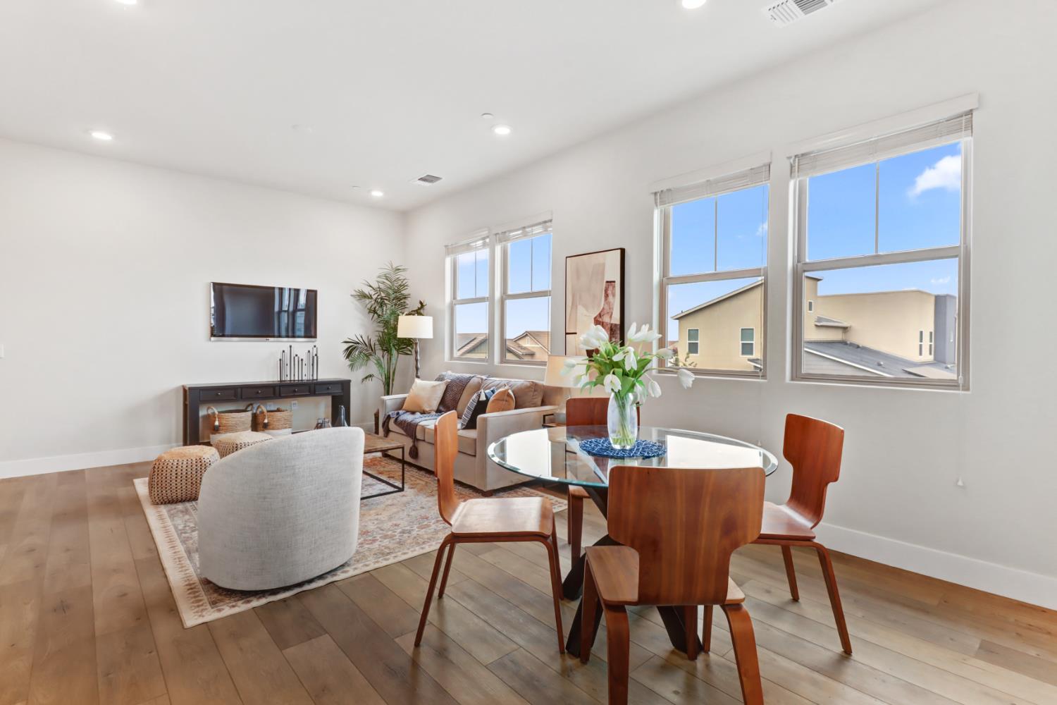1661 Spring Street, Unit 343 Davis, CA 95616 - Photo 14 of 52 a dining room with furniture and wooden floor