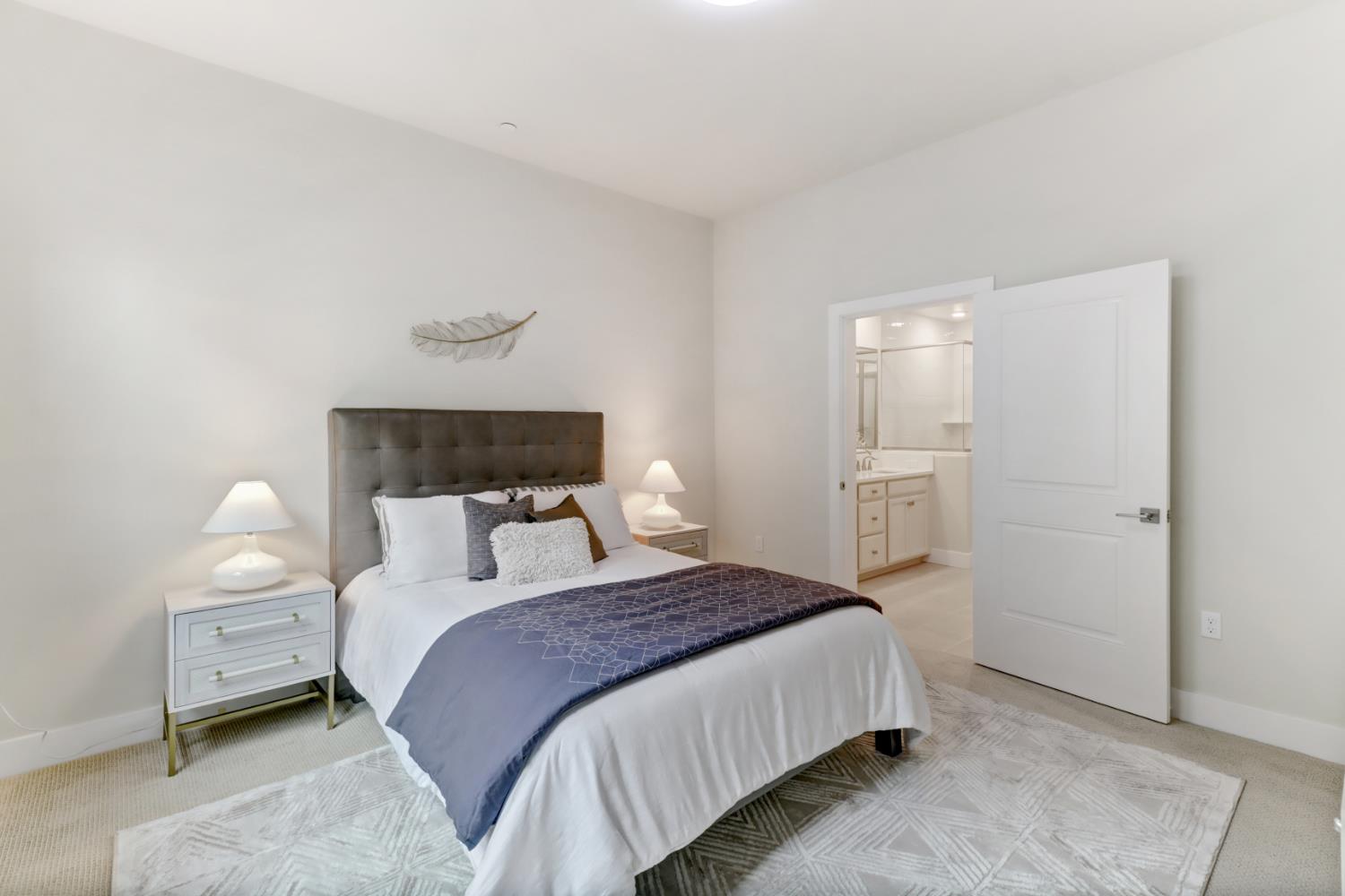 1661 Spring Street, Unit 343 Davis, CA 95616 - Photo 19 of 52 a bedroom with bed and a night stand