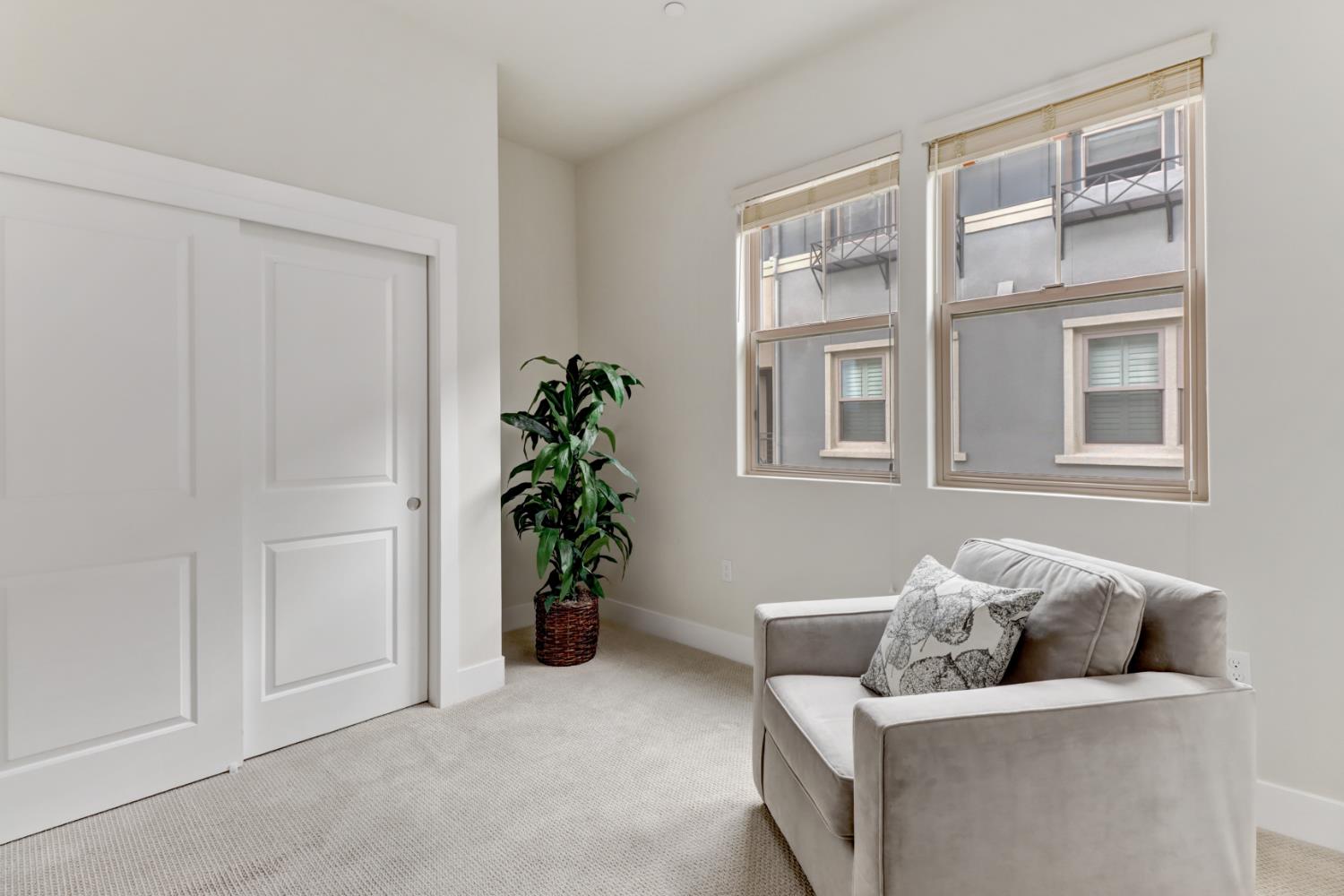 1661 Spring Street, Unit 343 Davis, CA 95616 - Photo 27 of 52 a living room with furniture and flowers