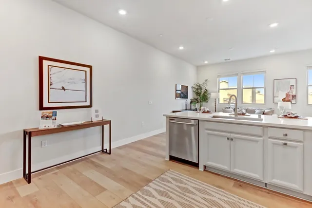 a spacious bathroom with a double vanity sink and a mirror