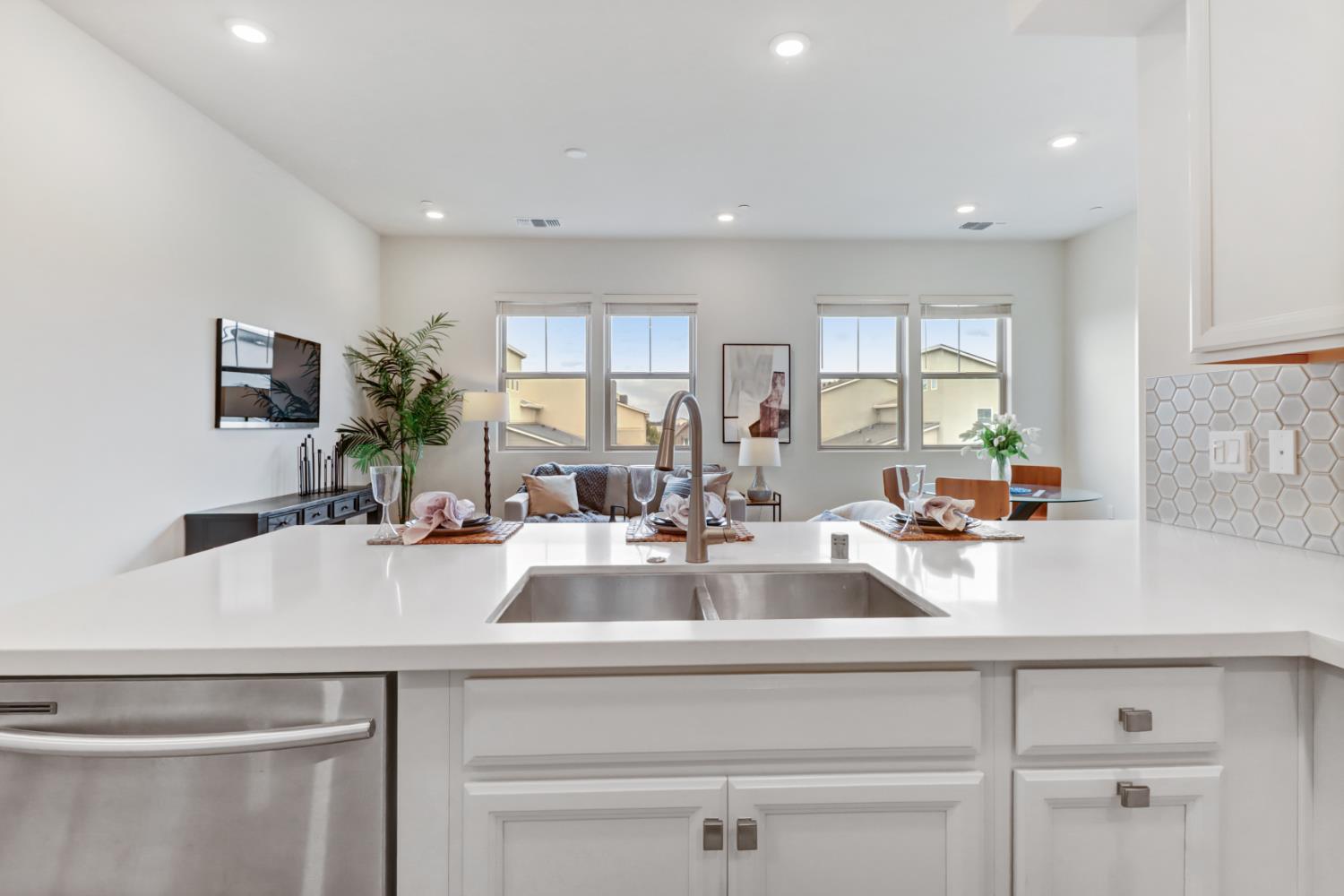 1661 Spring Street, Unit 343 Davis, CA 95616 - Photo 9 of 52 a kitchen with sink and view living room