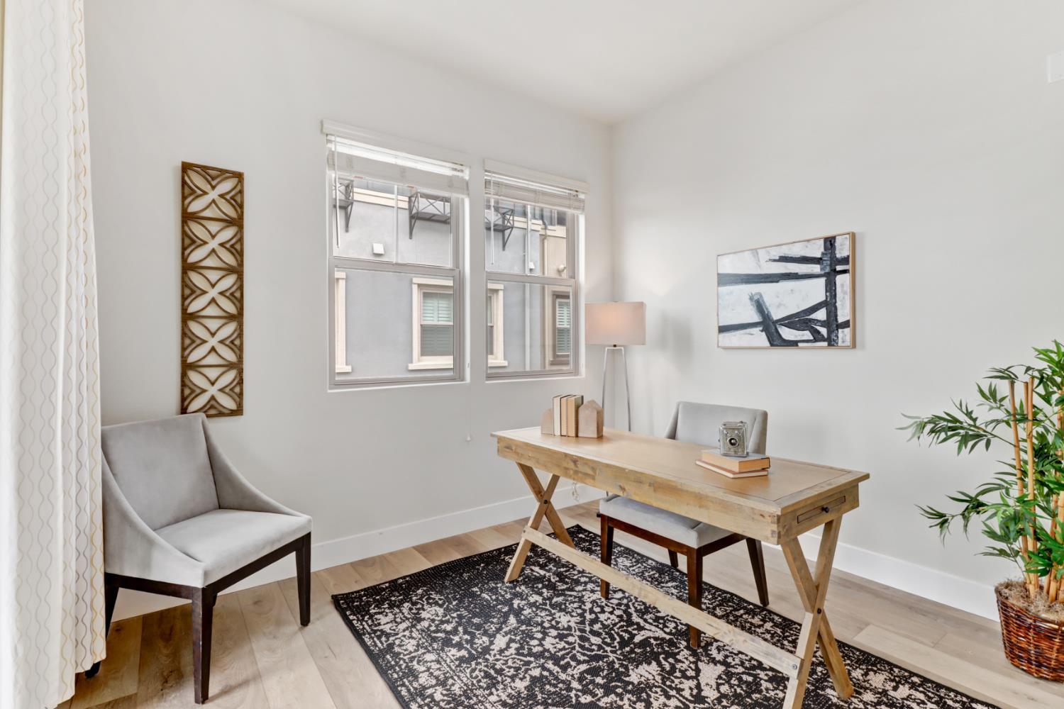 1661 Spring Street, Unit 343 Davis, CA 95616 - Photo 10 of 52 a dining room with furniture and wooden floor