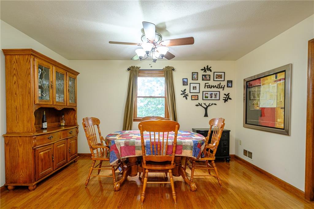 3121 Conway Wallrose Road Baden, PA 15005 - Photo 8 of 25 a view of a dining room with furniture window and wooden floor
