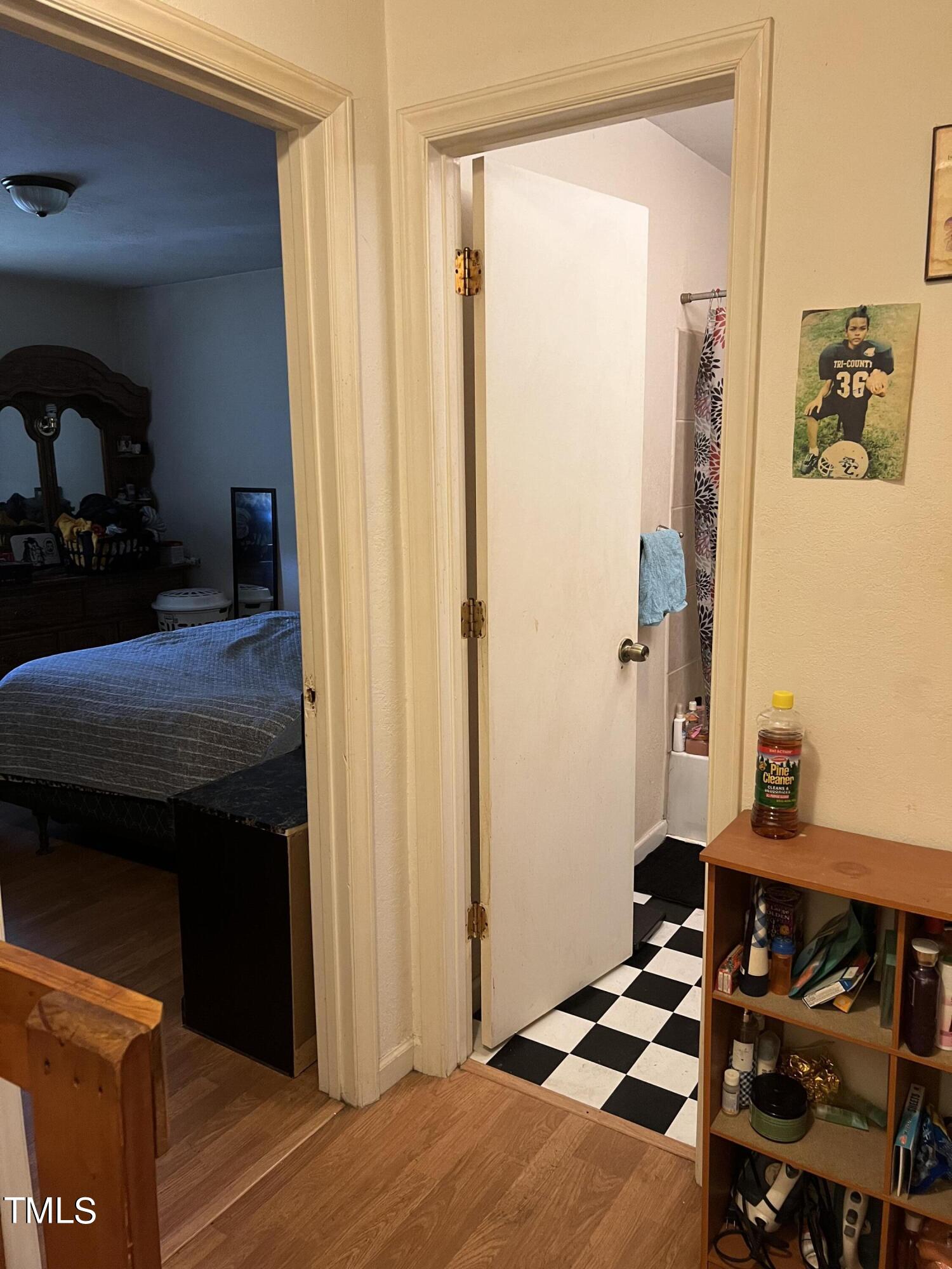 626 Middle Street Durham, NC 27703 - Photo 14 of 42 a bedroom with a bed and a mirror