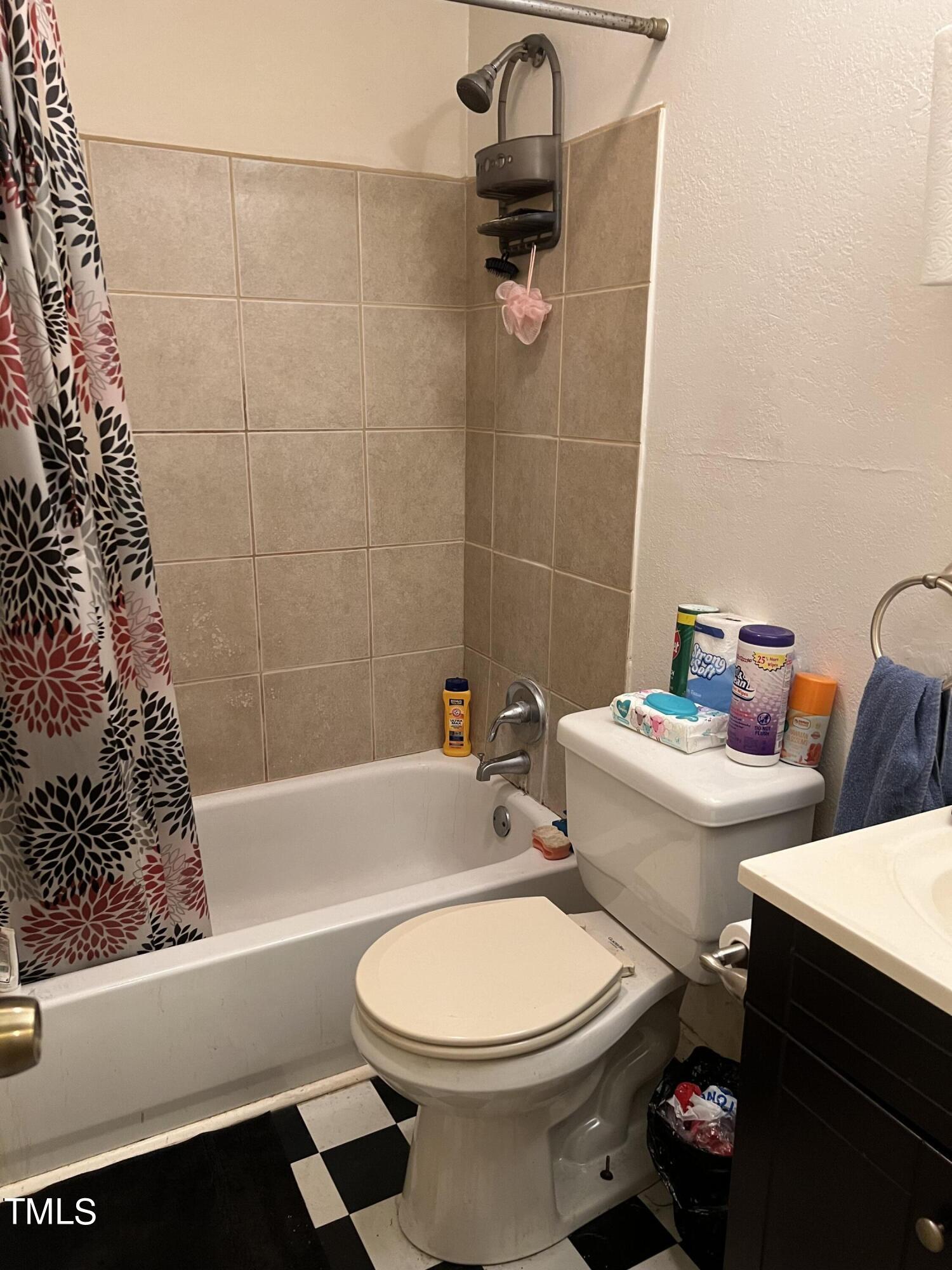 626 Middle Street Durham, NC 27703 - Photo 15 of 42 a white toilet sitting next to a bath tub