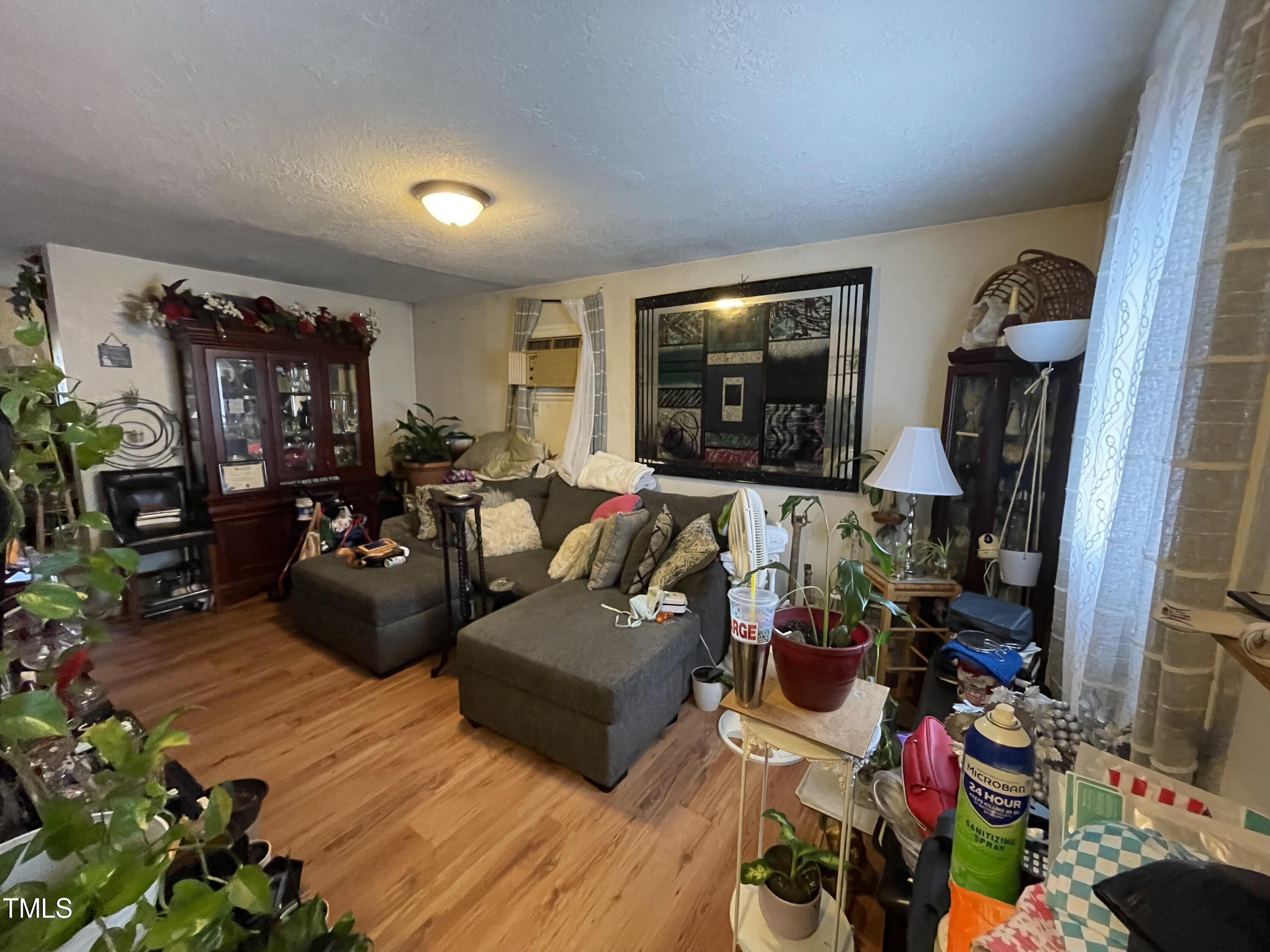 626 Middle Street Durham, NC 27703 - Photo 20 of 42 a living room with furniture and a flat screen tv