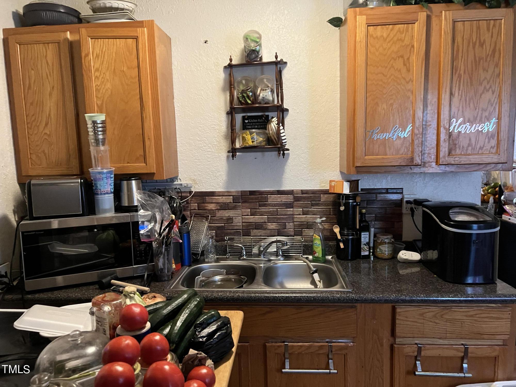 626 Middle Street Durham, NC 27703 - Photo 24 of 42 a kitchen with stainless steel appliances granite countertop a stove and a sink