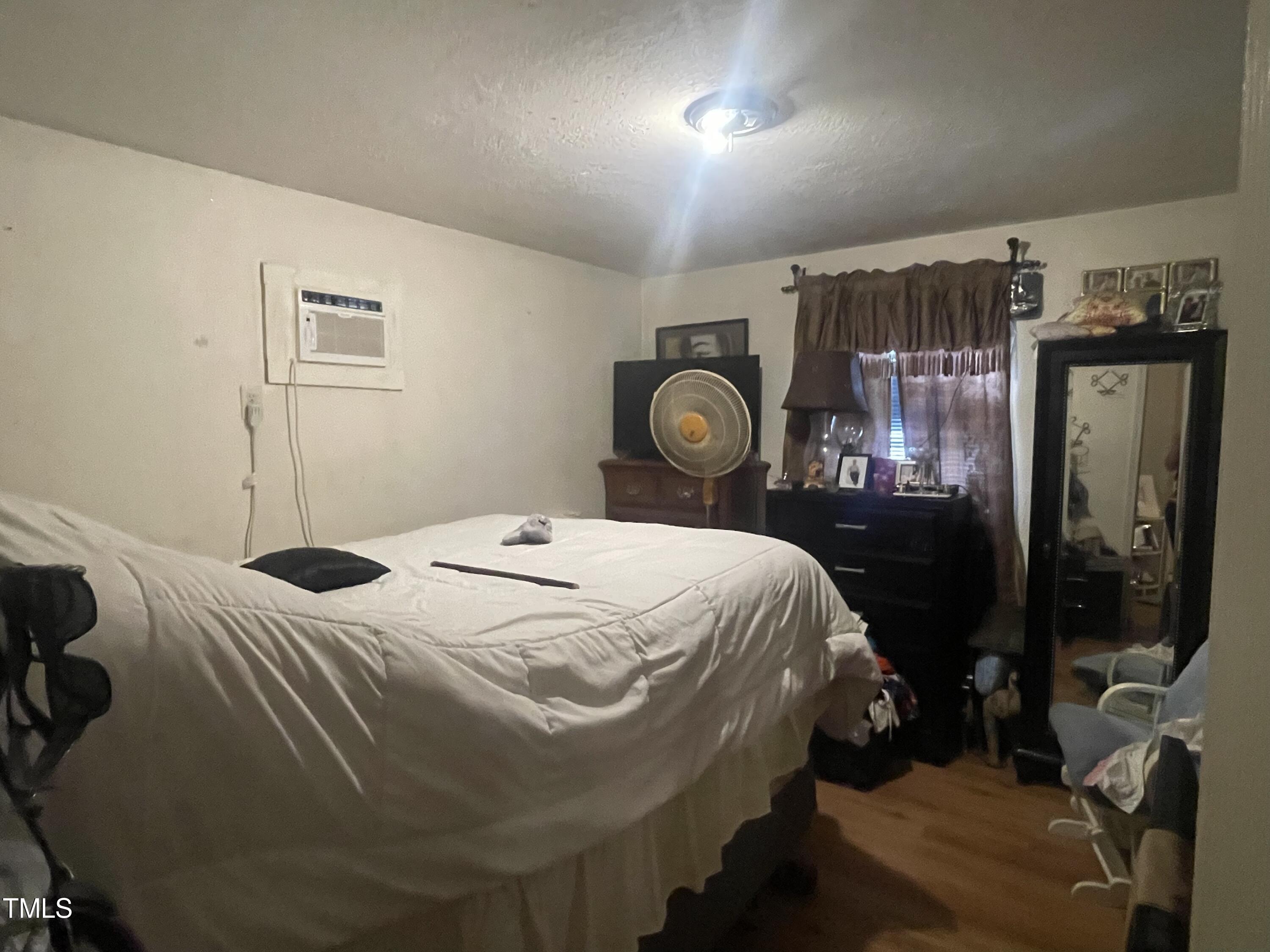 626 Middle Street Durham, NC 27703 - Photo 28 of 42 a bedroom with a bed and window