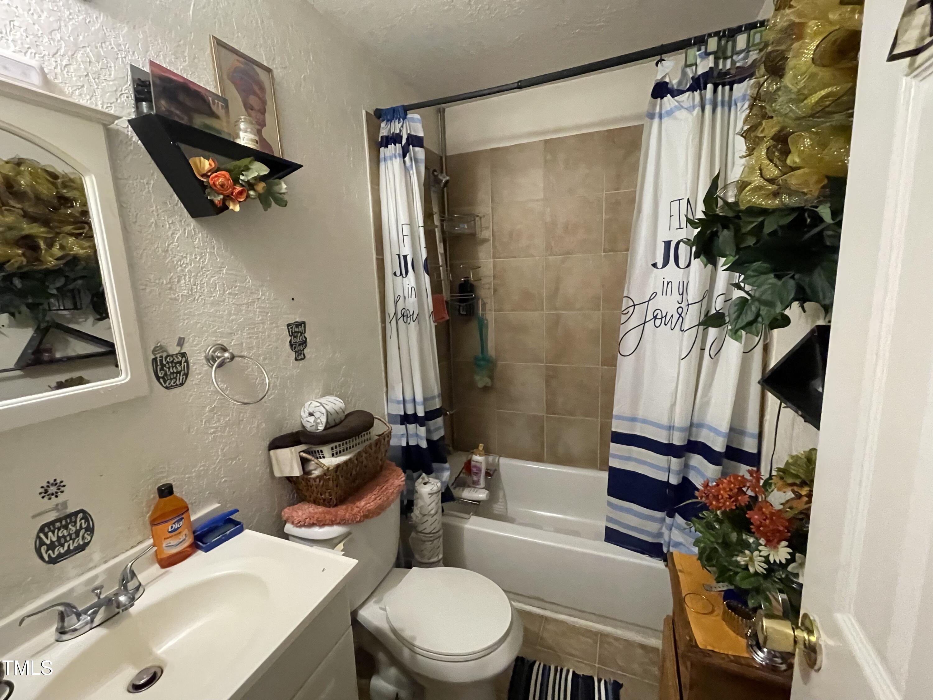 626 Middle Street Durham, NC 27703 - Photo 30 of 42 a bathroom with a sink toilet and shower
