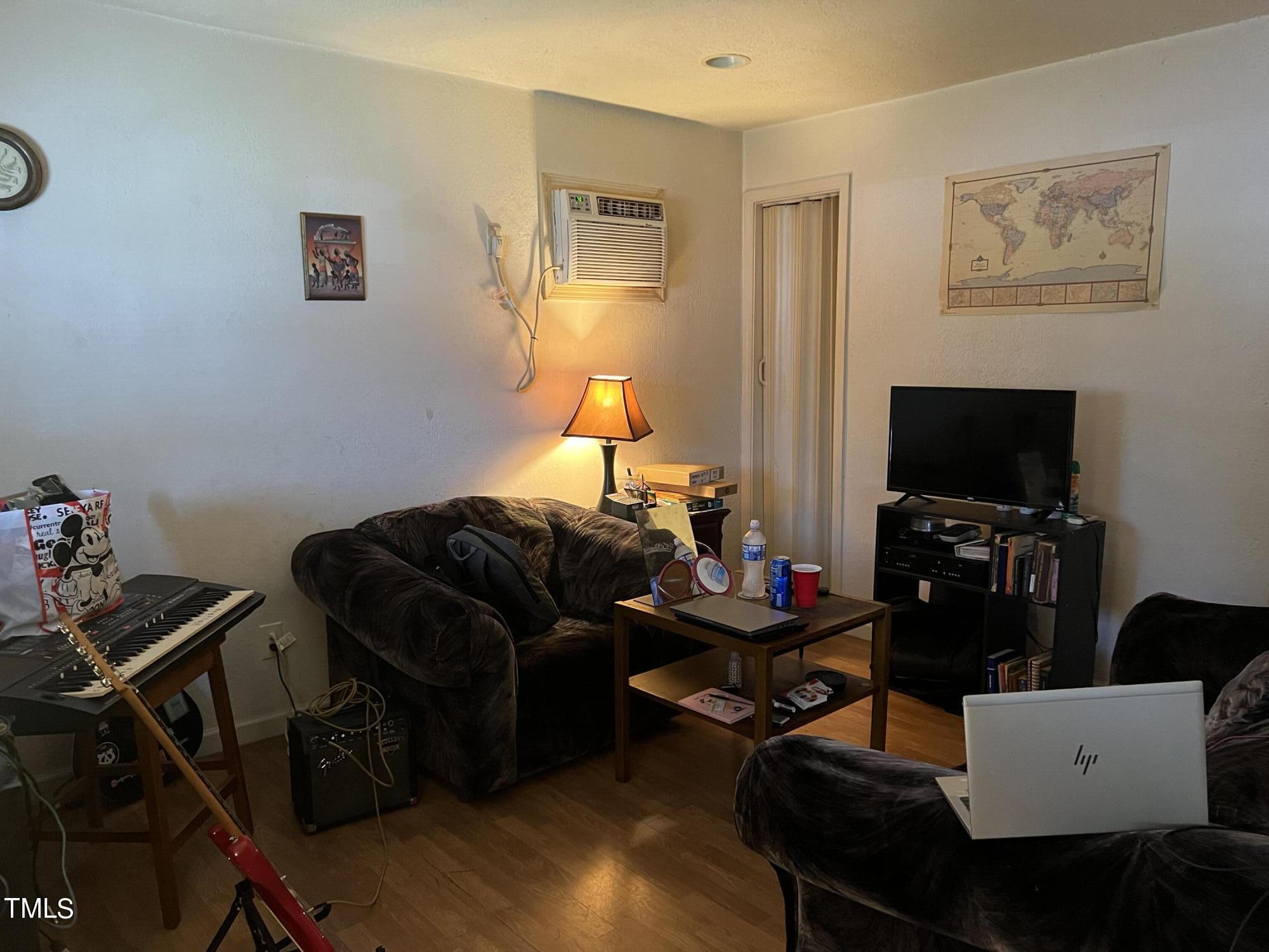 626 Middle Street Durham, NC 27703 - Photo 4 of 42 a living room with furniture and a flat screen tv