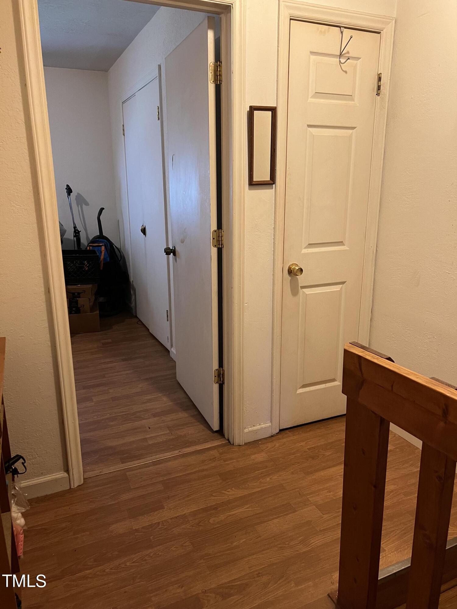 626 Middle Street Durham, NC 27703 - Photo 10 of 42 a view of a hallway with wooden floor and staircase