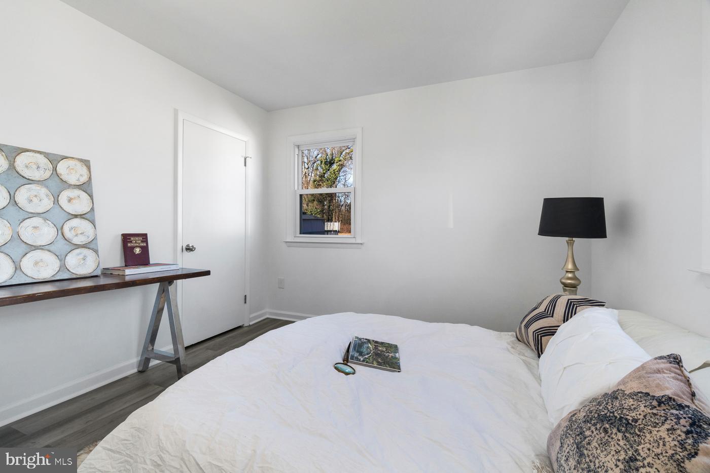510 Davis Road Barrington, NJ 08007 - Photo 23 of 29 a bedroom with a bed and a lamp on table