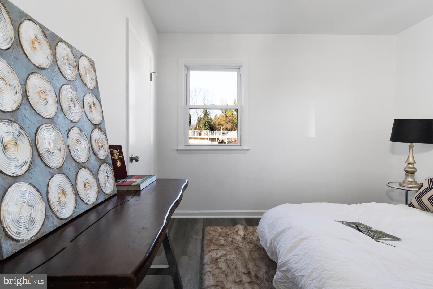 510 Davis Road Barrington, NJ 08007 - Photo 24 of 29 a bedroom with a bed and a lamp on the dresser