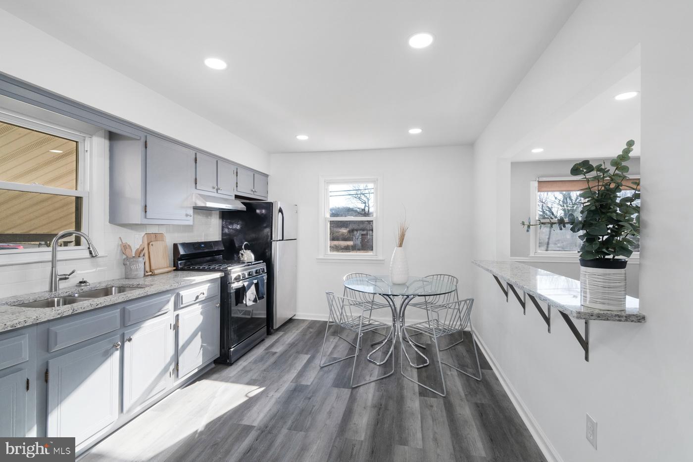 510 Davis Road Barrington, NJ 08007 - Photo 10 of 29 a kitchen with white cabinets appliances and sink