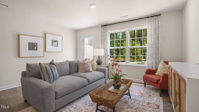 a living room with furniture and a window