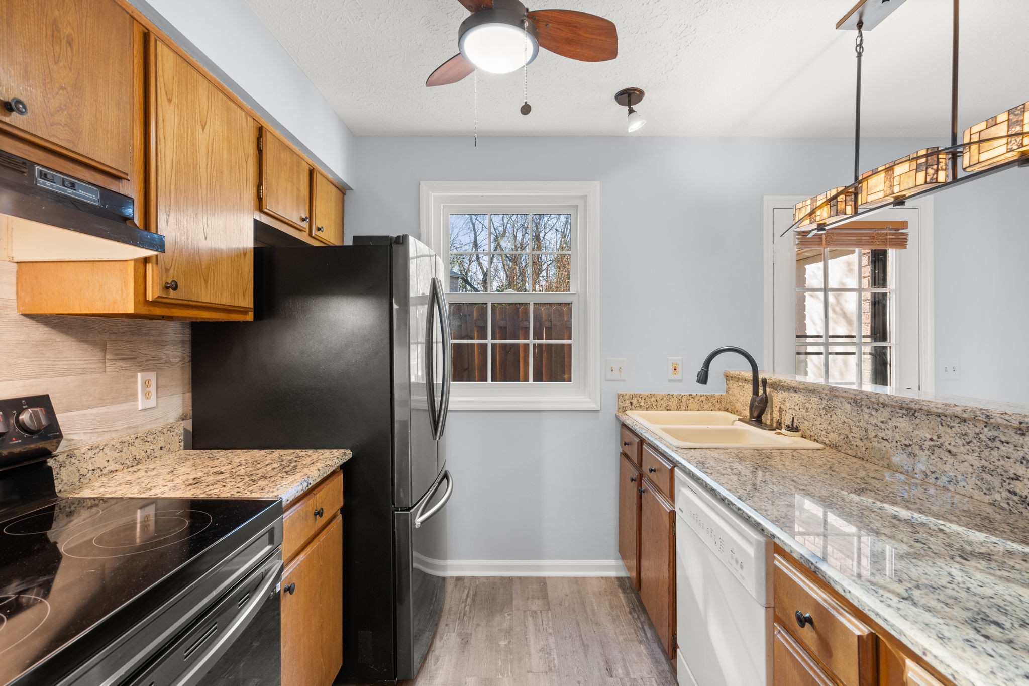 129 Thistle Lane Hermitage, TN 37076 - Photo 11 of 22 a kitchen with a stove and a wooden floor