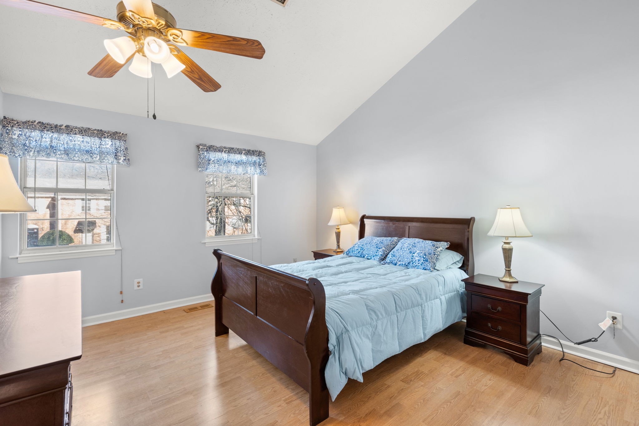 129 Thistle Lane Hermitage, TN 37076 - Photo 12 of 22 a bedroom with a bed and a chandelier