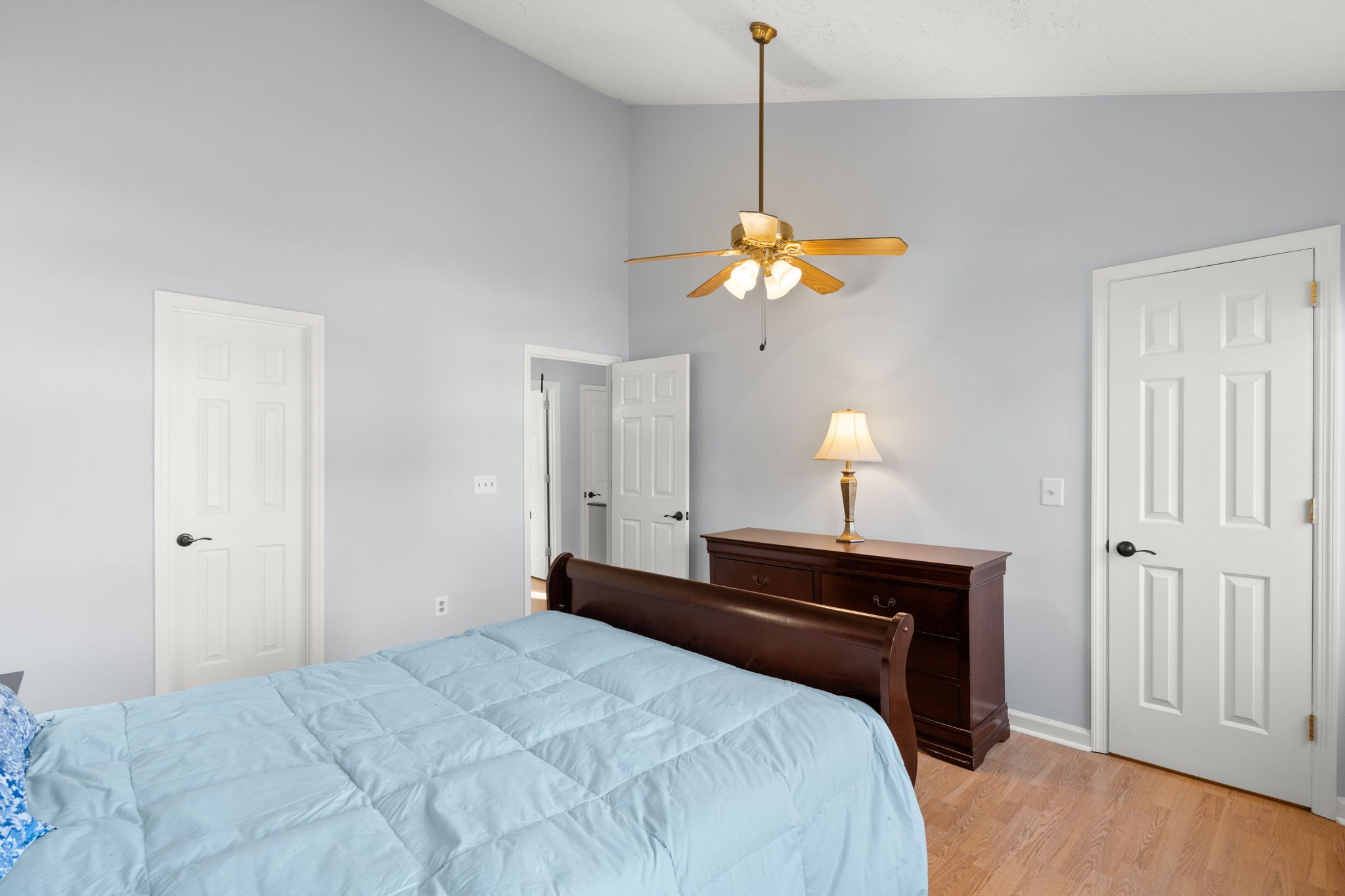 129 Thistle Lane Hermitage, TN 37076 - Photo 13 of 22 a bedroom with a bed and a chandelier