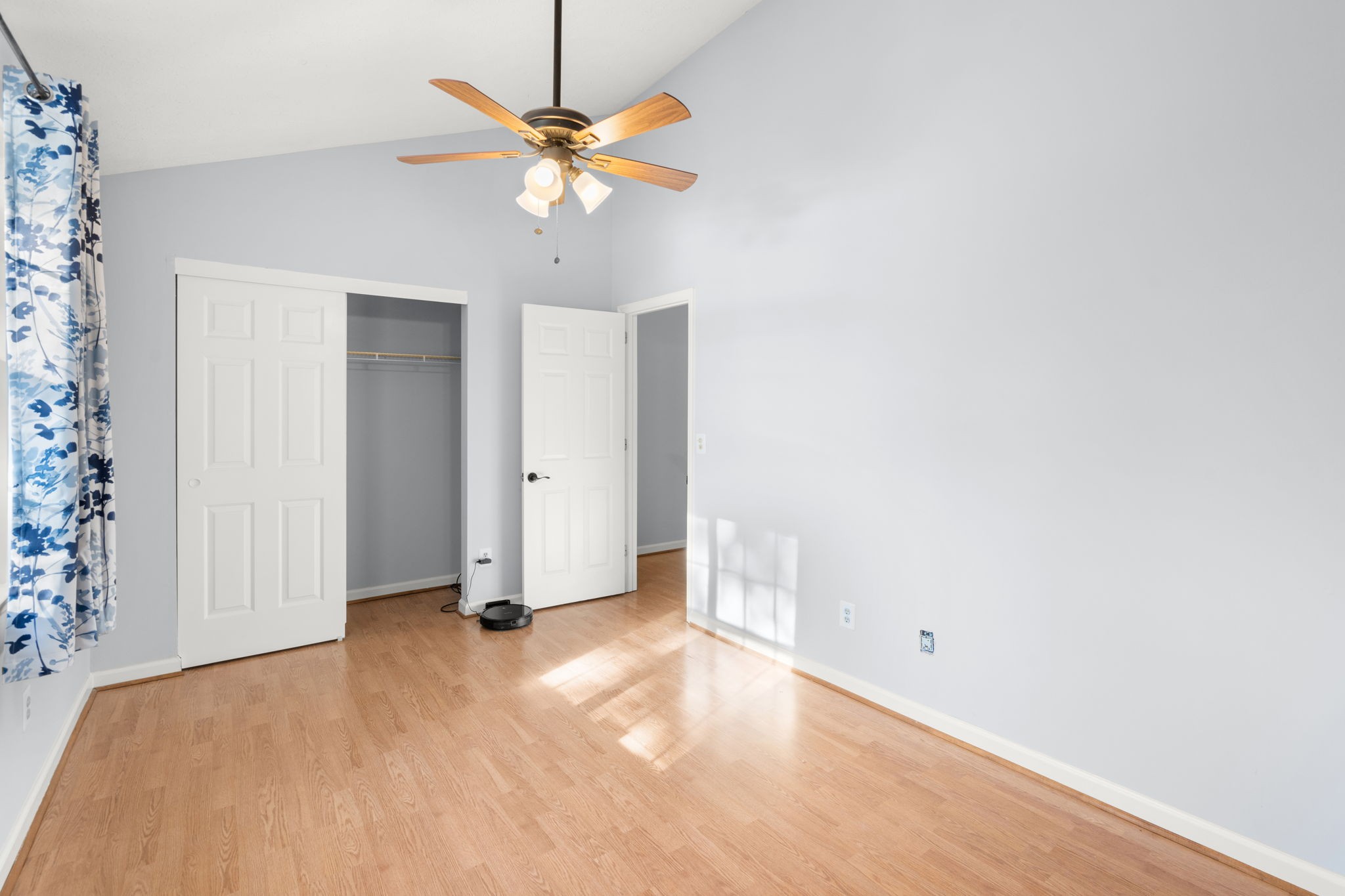 129 Thistle Lane Hermitage, TN 37076 - Photo 17 of 22 an empty room with closet and a chandelier fan