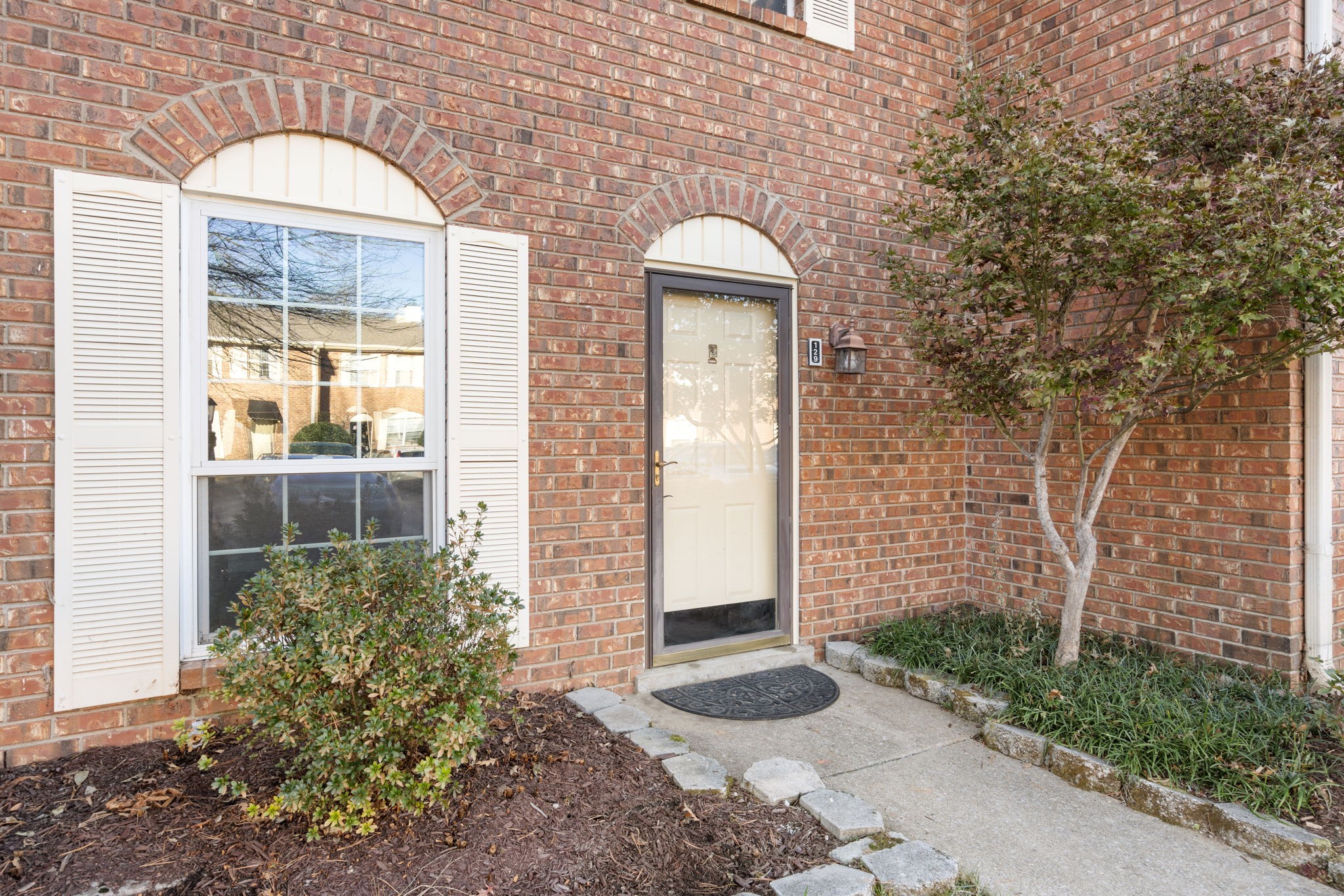 129 Thistle Lane Hermitage, TN 37076 - Photo 3 of 22 a front view of a house with garden