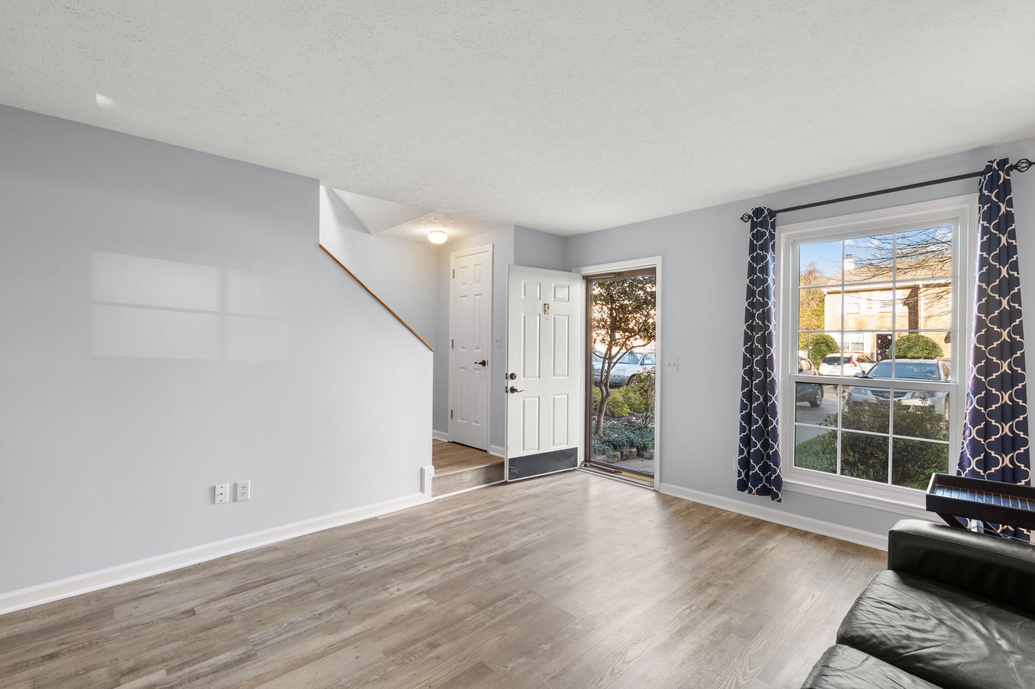129 Thistle Lane Hermitage, TN 37076 - Photo 4 of 22 wooden floor in an empty room with a window